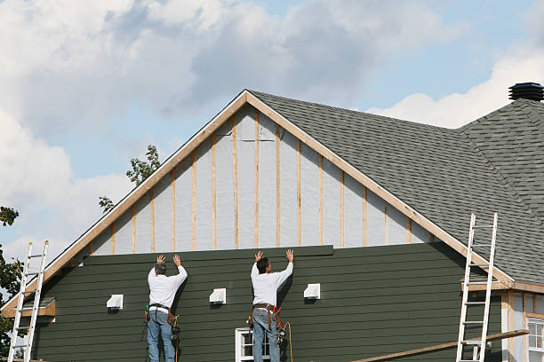 Professional Emergency Siding Repair technician working in Collins, OH